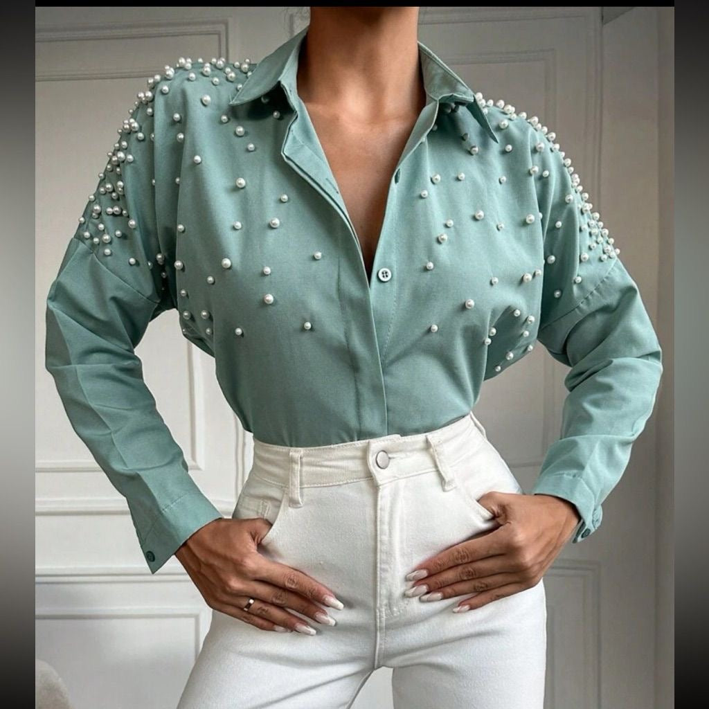 This pearl-detailed shirt brings effortless luxury to your everyday style.